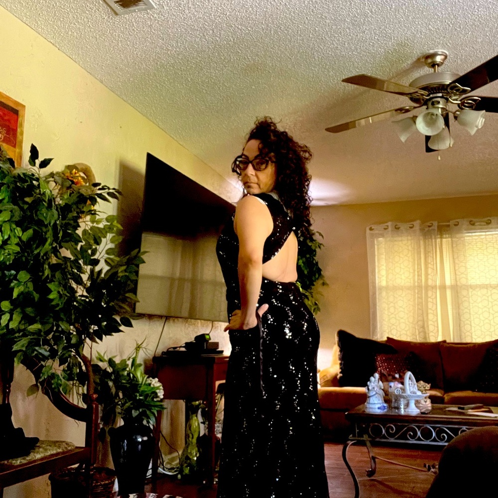 Formal dress  and smoke free home. worn 1X material is Lacey with silver sequins